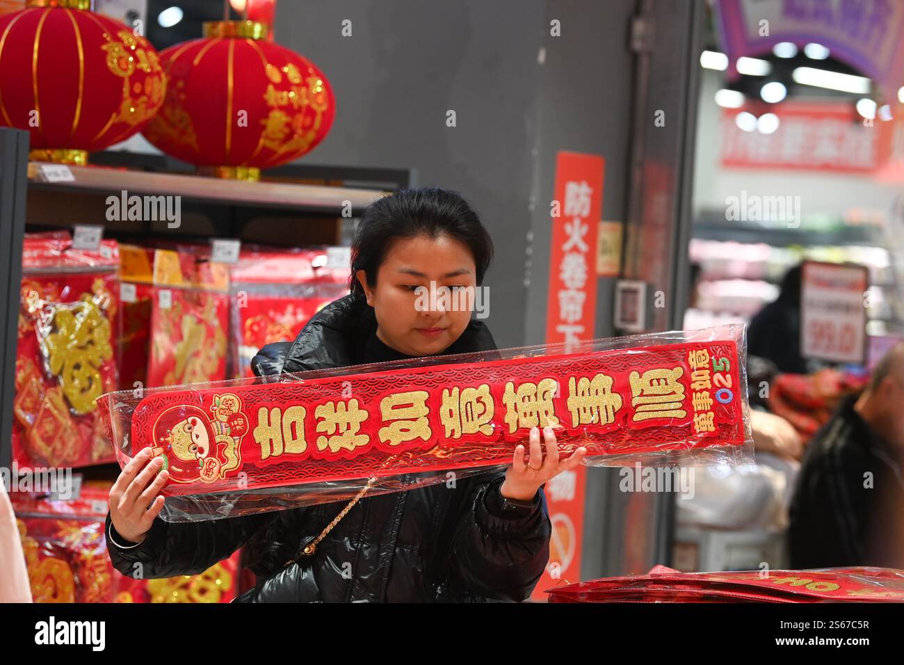 People select Spring Festival decorations in a market in Chongqing