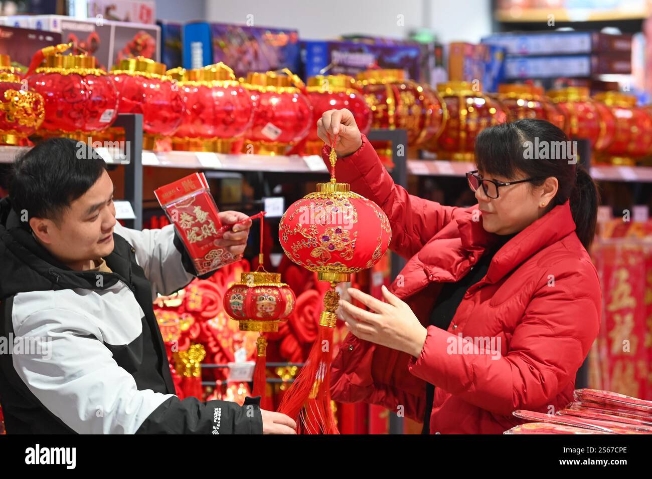 People select Spring Festival decorations in a market in Chongqing