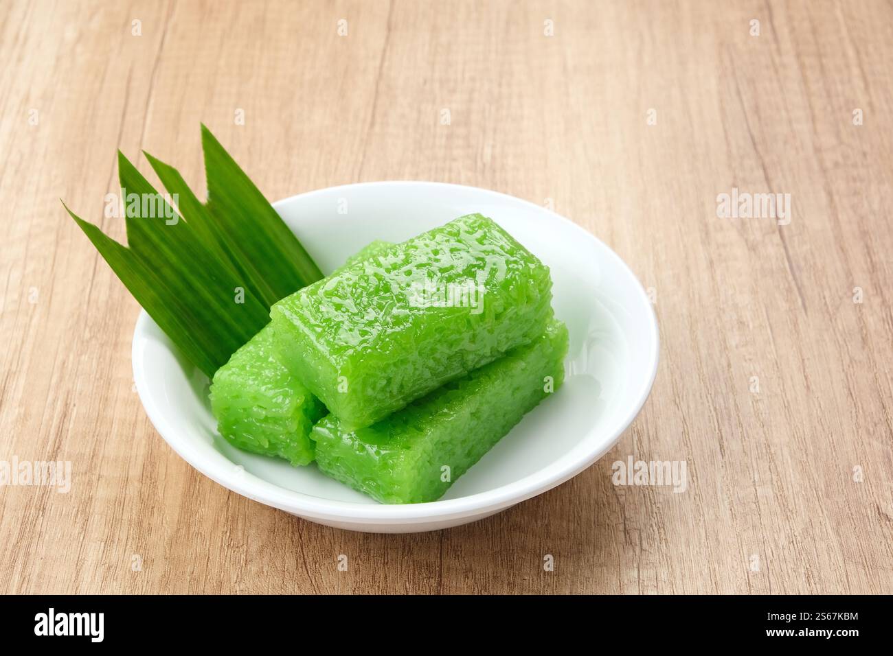 Wajik, traditional Indonesian snack made from steamed sticky rice, sugar, coconut milk, and pandan leaves. Stock Photo