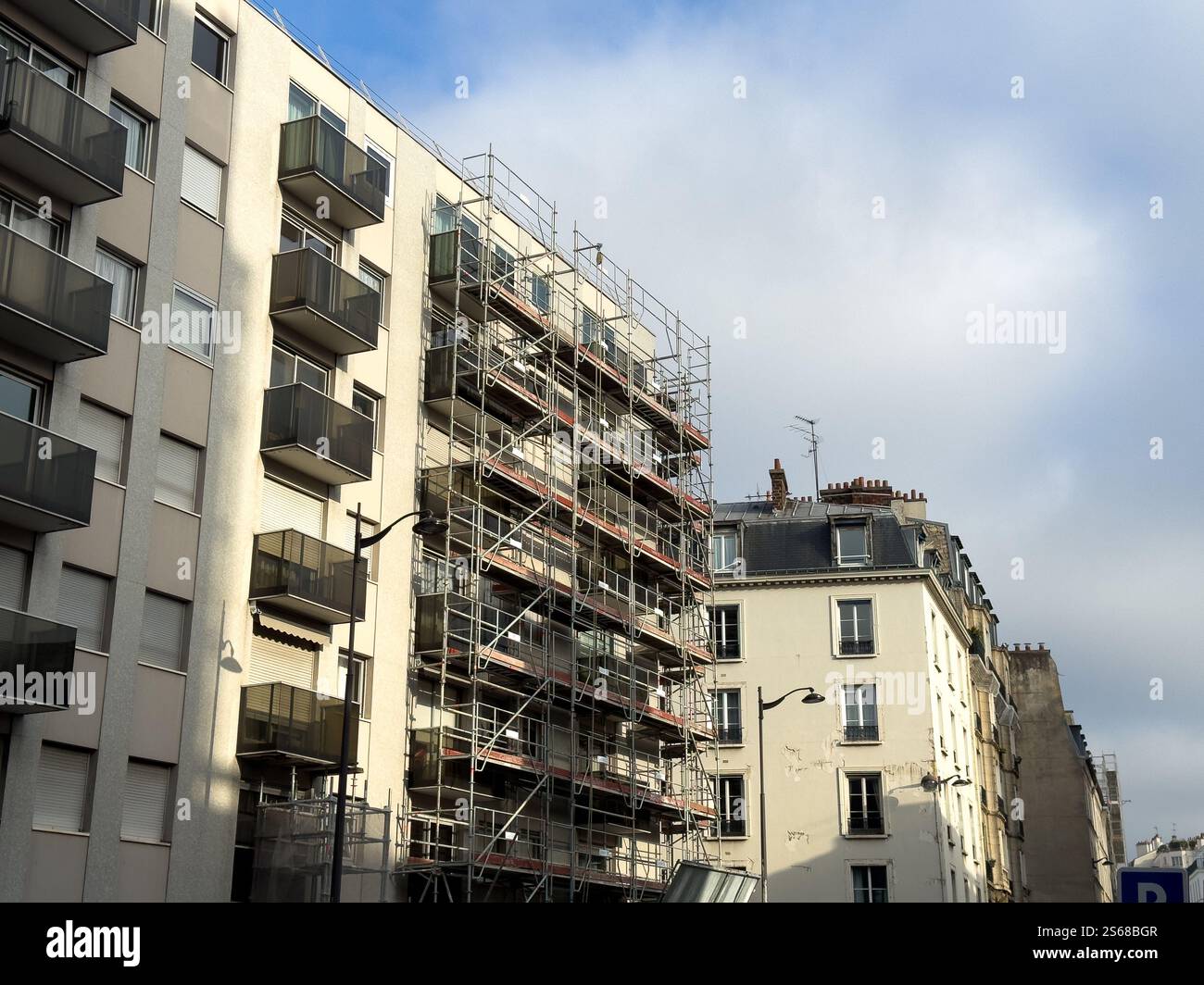 Curated visual reference: Visual Reference: Renovation Work On Apartment Building In A Residential Area Stock