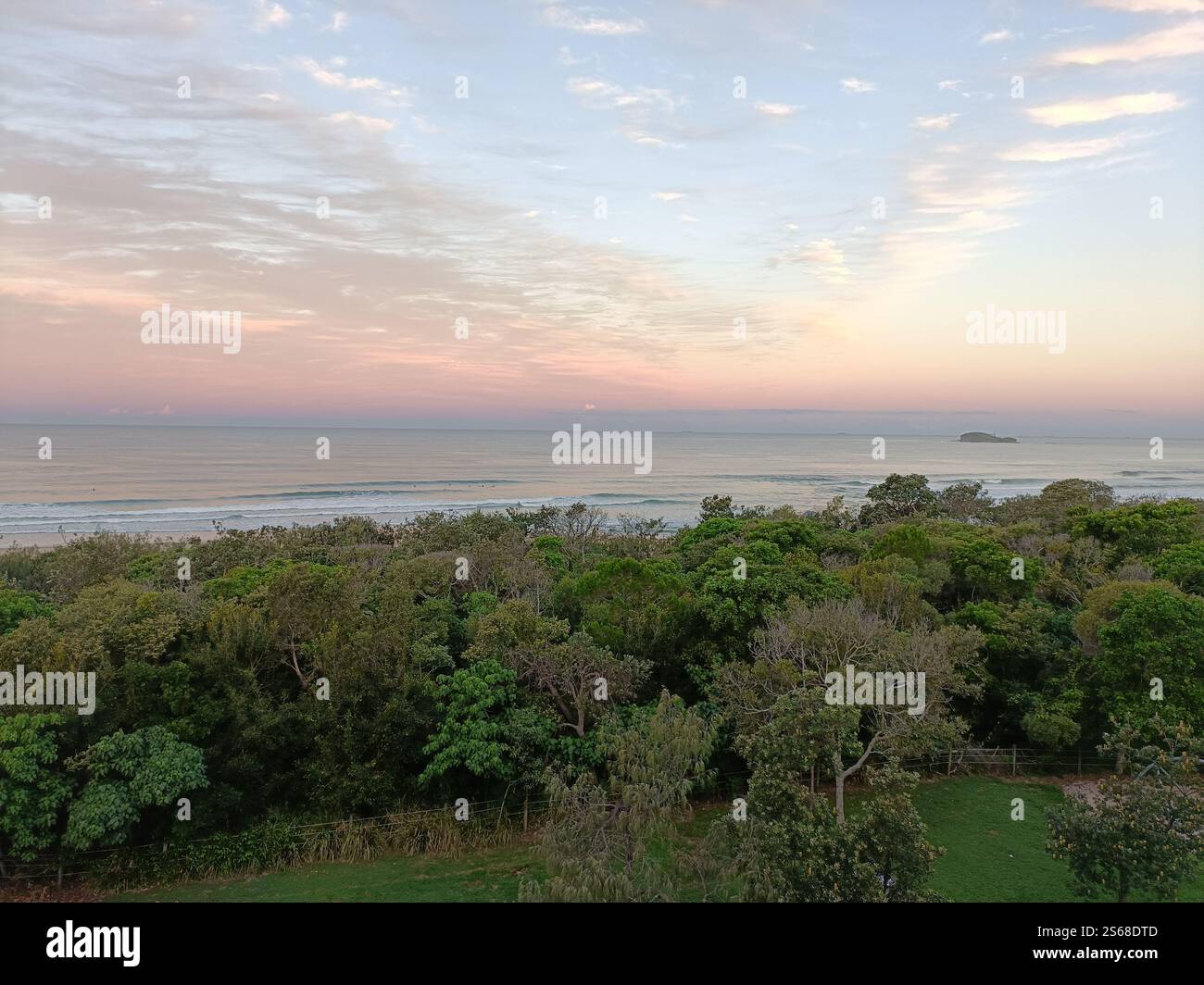 Sunset at Marcoola Beach, Sunshine Coast,  Australia, Mudjimba Island or Old Woman Island where you can do snorkelling, scuba diving and reef fishing - Smartphone Captured Stock Image