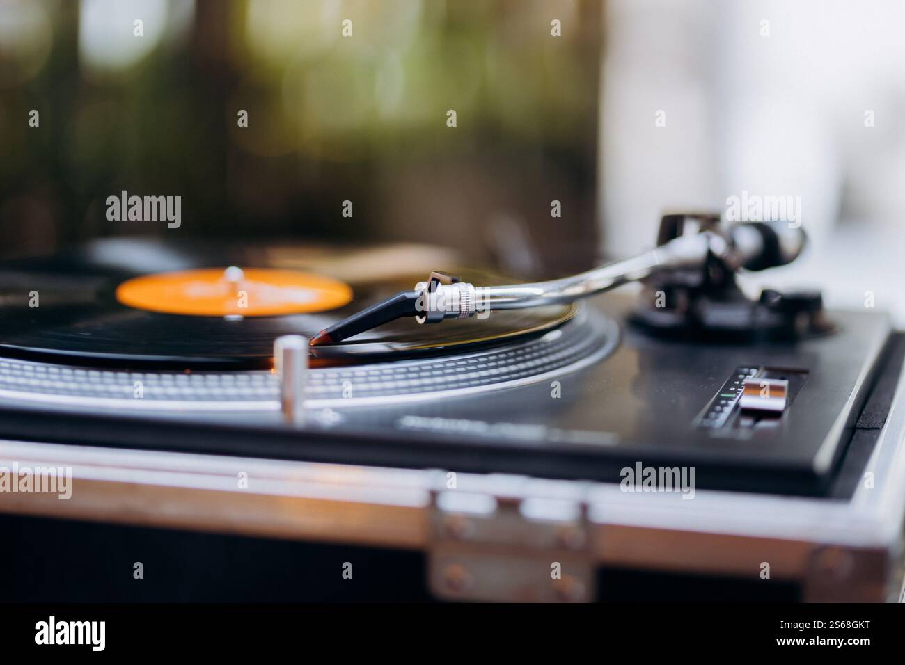Turntable needle on a spinning vinyl record, evoking vintage charm and timeless music vibes ...