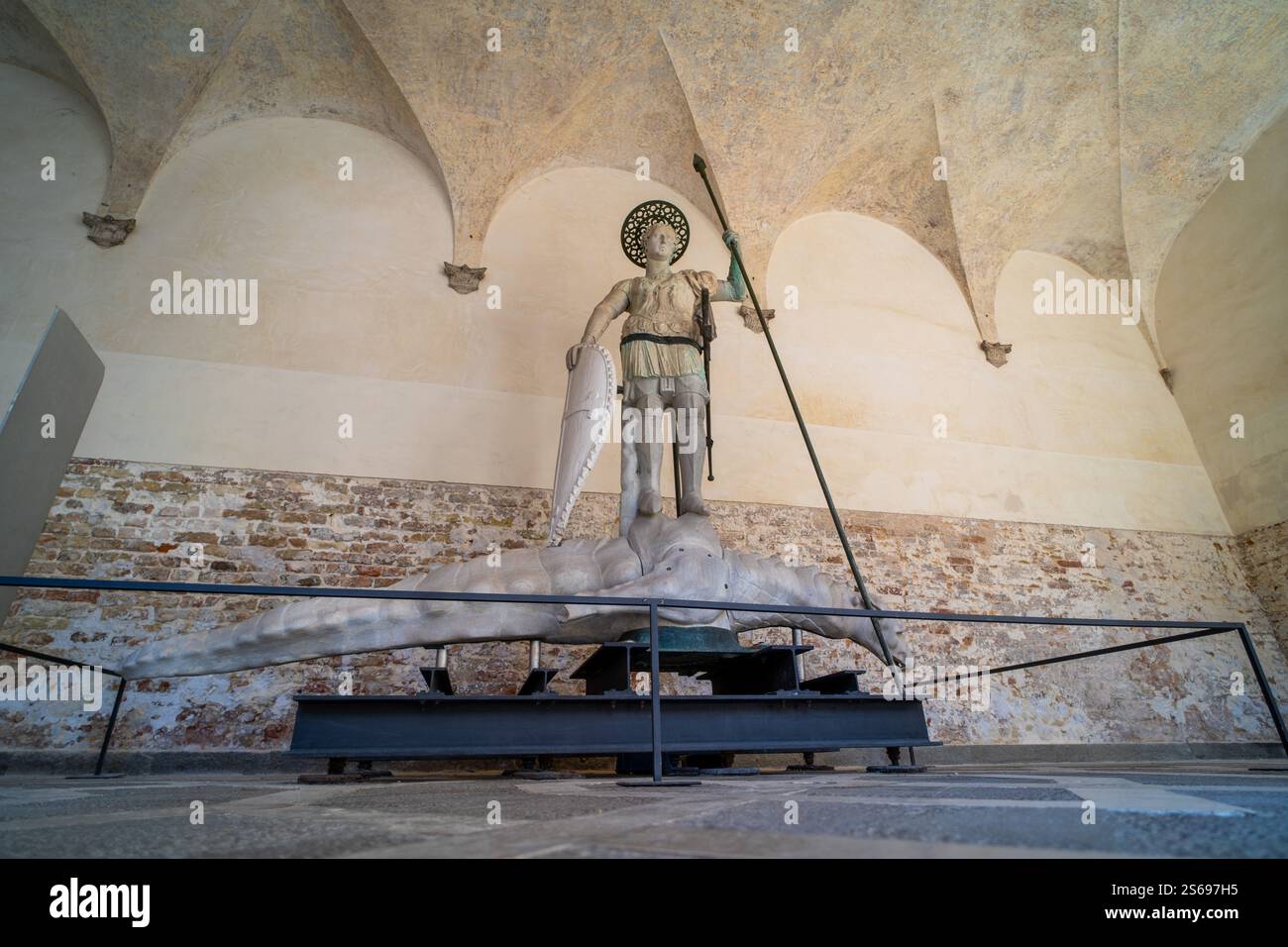 A dramatic statue of a warrior armed with a spear and shield, standing ...