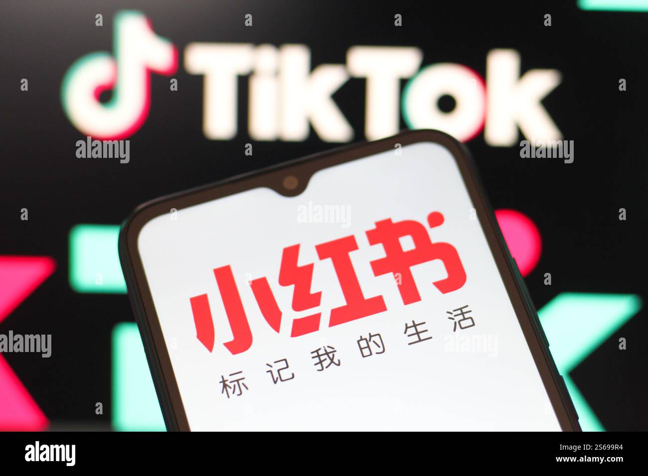 In this photo illustration, the Xiaohongshu (Rednote) logos is seen ...