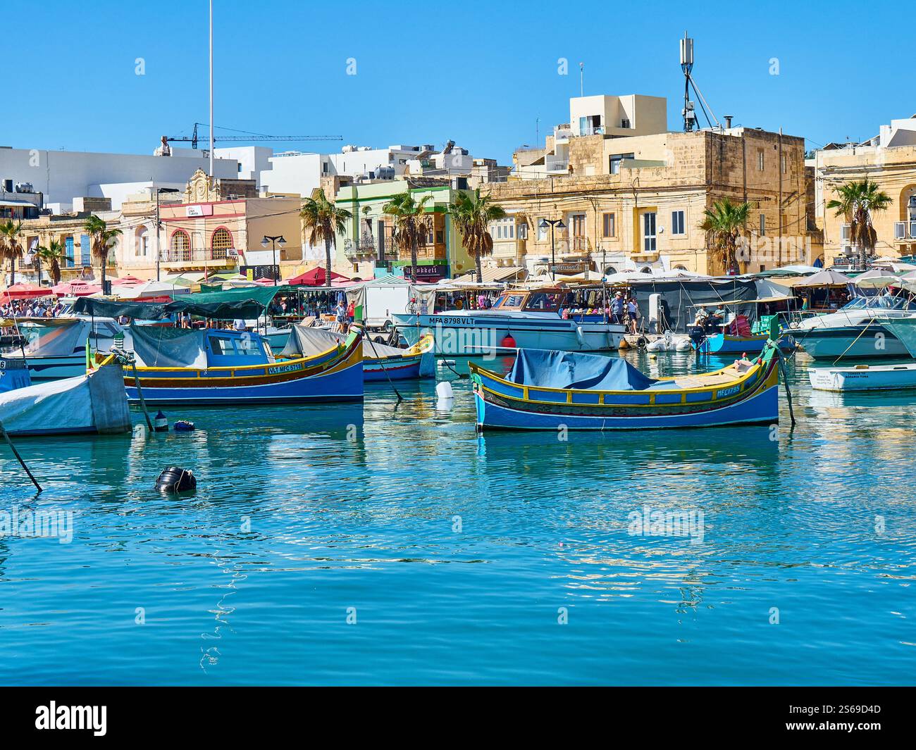 Traditional fishing boats in Marsaxlokk harbor. Marsaxlokk is one of