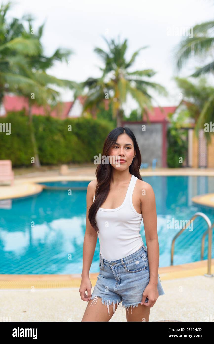 Young Asian woman swimming pool portrait Stock Photo - Alamy