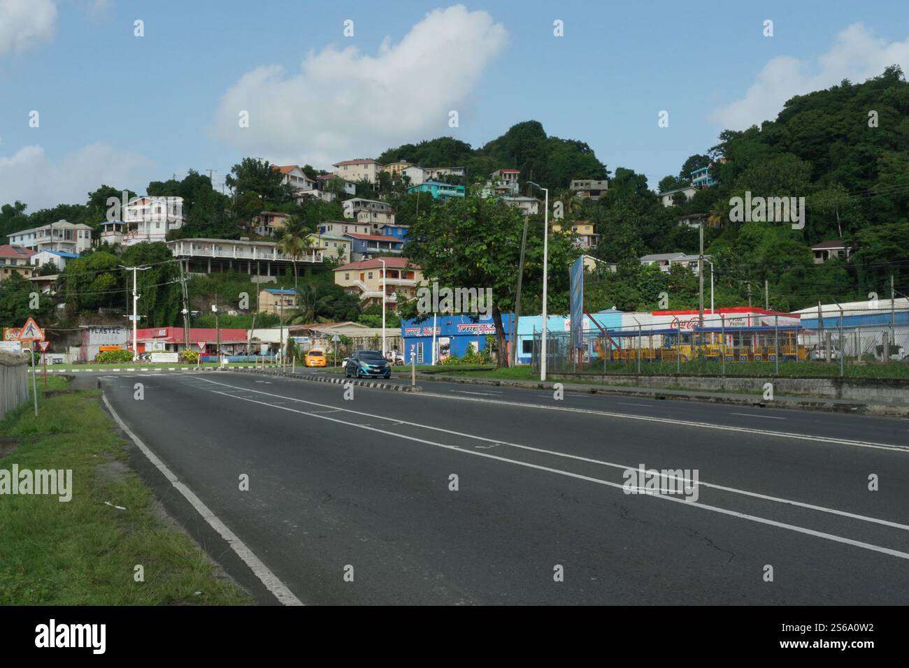 A main road going around airport on the Caribbean island of Saint Lucia at Castries harbour. Stock Photo