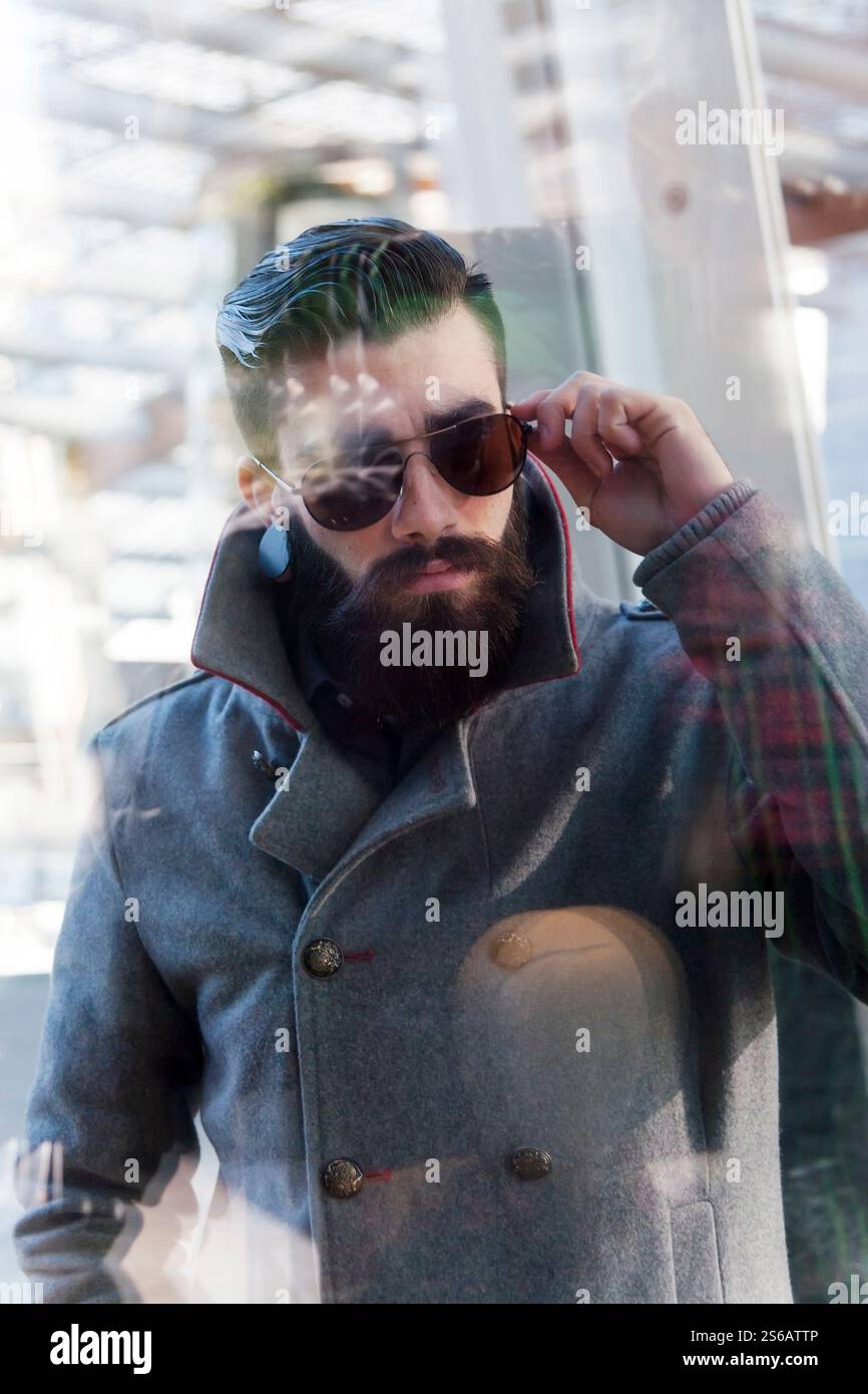 businessman looking through window Stock Photo