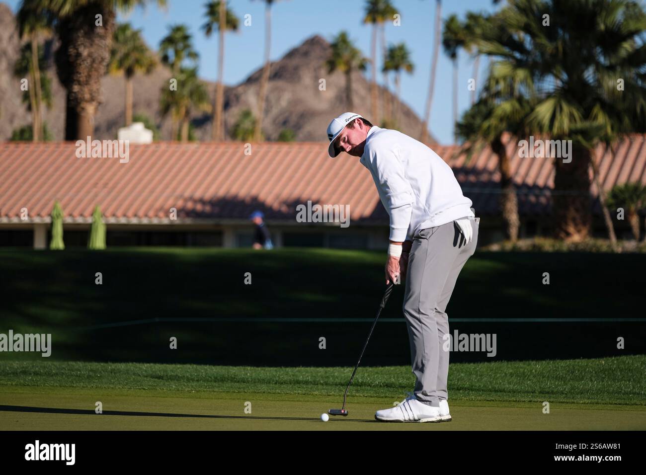 Nick Dunlap prepares to putt on the first green at La Quinta Country