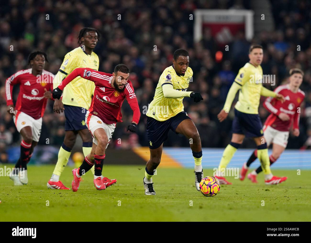 Manchester, UK. 16th Jan, 2025. Joe Aribo of Southampton moves away from Noussair Mazraoui of Manchester United during the Premier League match at Old Trafford, Manchester. Picture credit should read: Andrew Yates/Sportimage Credit: Sportimage Ltd/Alamy Live News Stock Photo