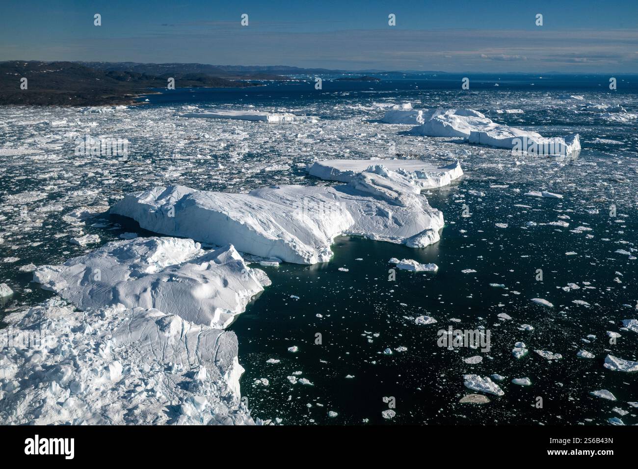 Expansive Icy Landscape With Floating Icebergs And Open Water In 