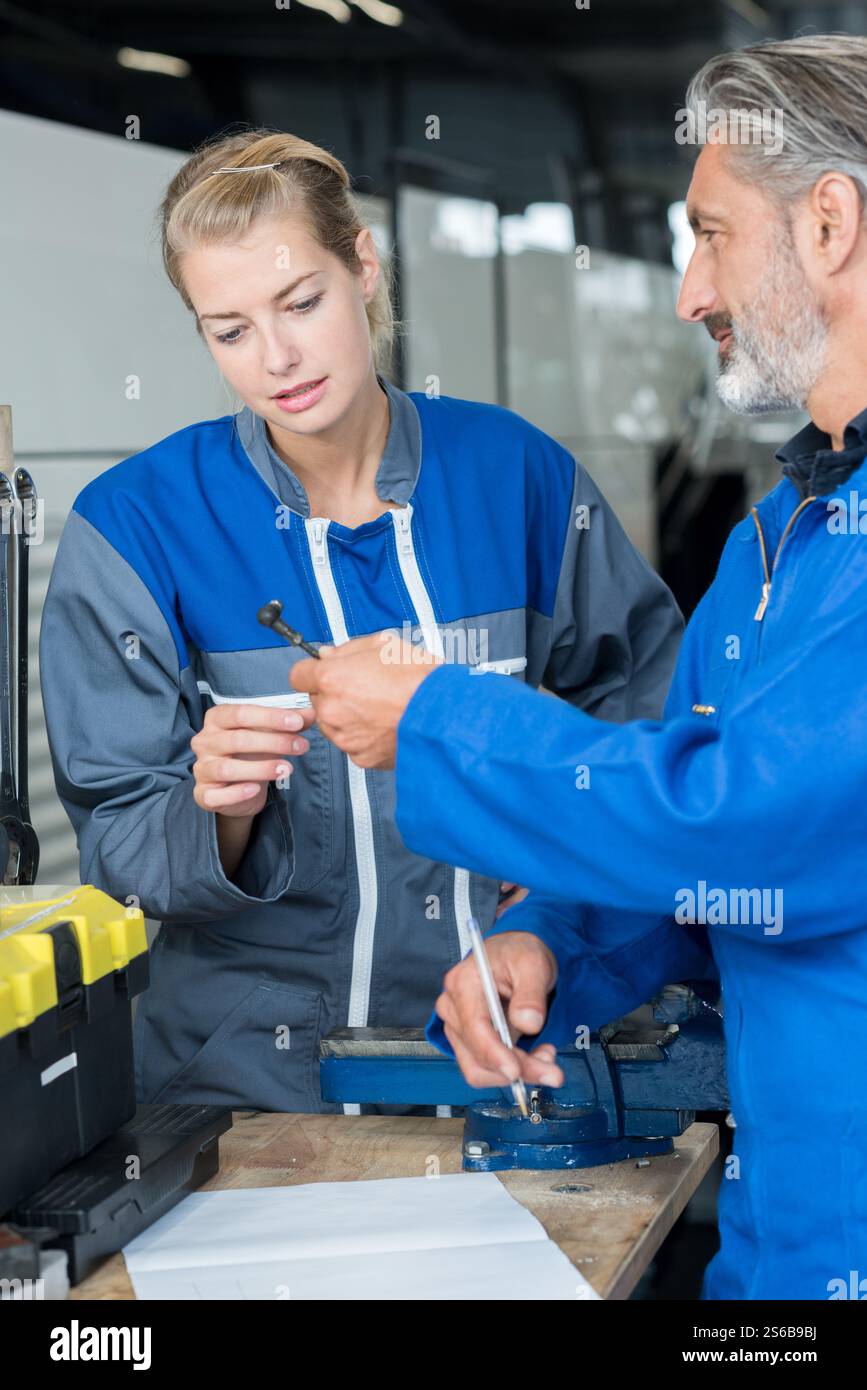 two technicians working in car service Stock Photo