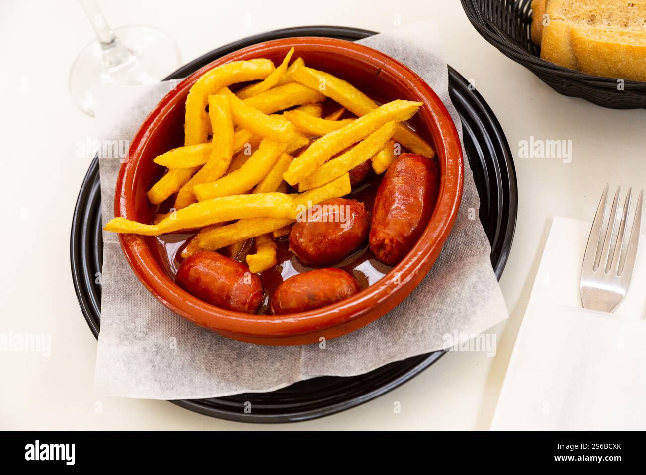 Popular Spanish tapa of smoked chorizo cooked in cider Stock Photo - Alamy