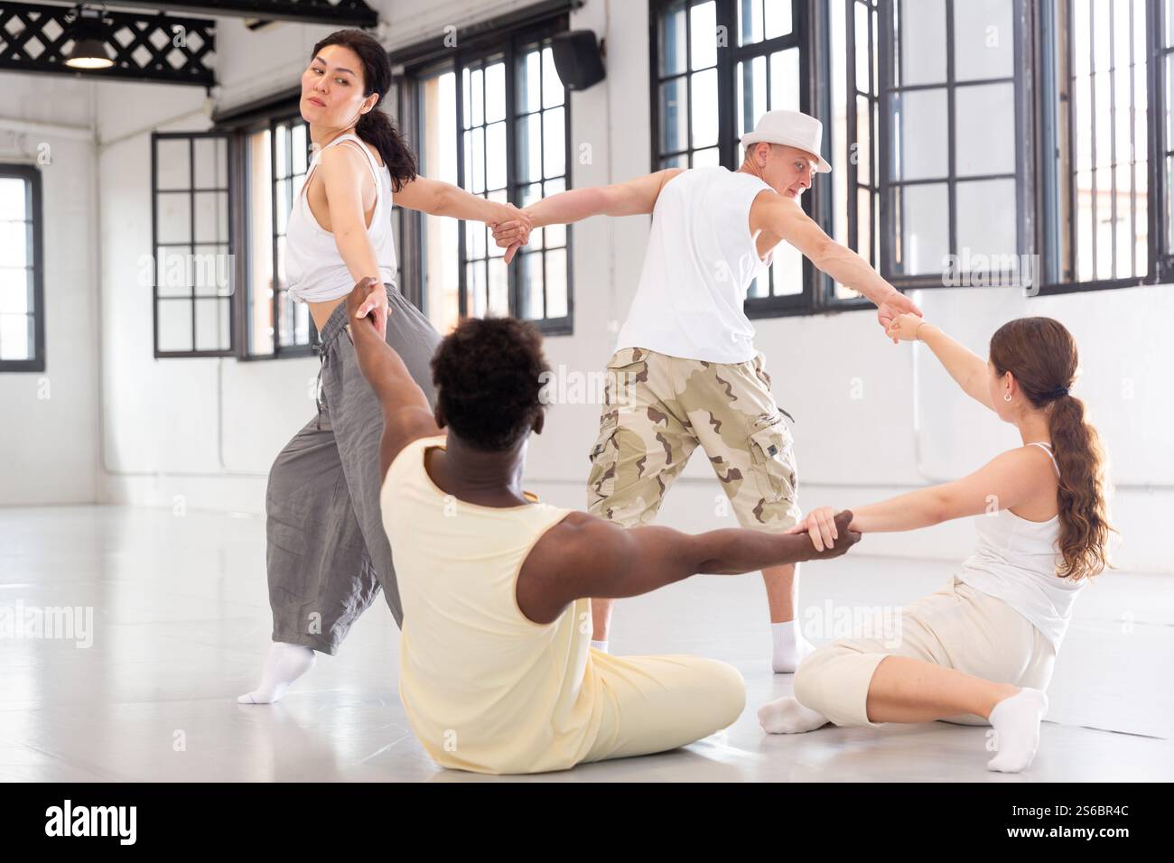 Group of artists demonstrating art performance Stock Photo - Alamy