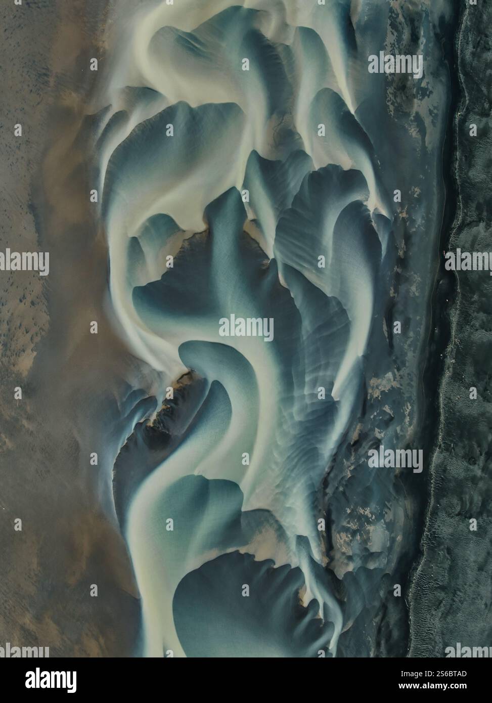 Aerial view of braided rivers in Iceland, showcasing stunning abstract ...