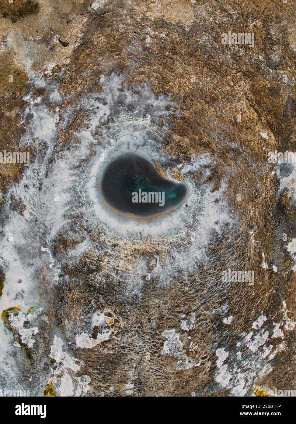 Aerial view of a geothermal hot spring at Hveravellir, Iceland, surrounded by mineral deposits and steaming volcanic terrain in the Highlands Stock Photo
