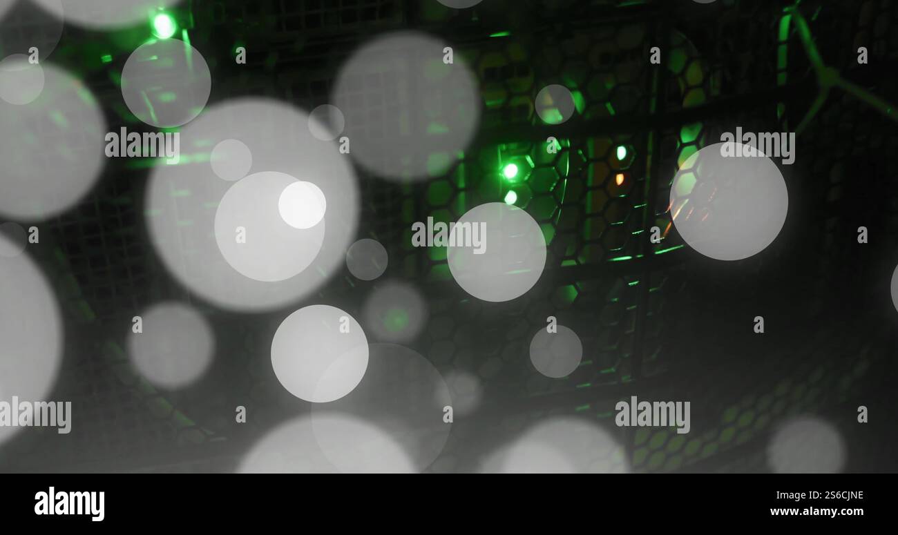 Image of glowing light spots over computer servers Stock Photo