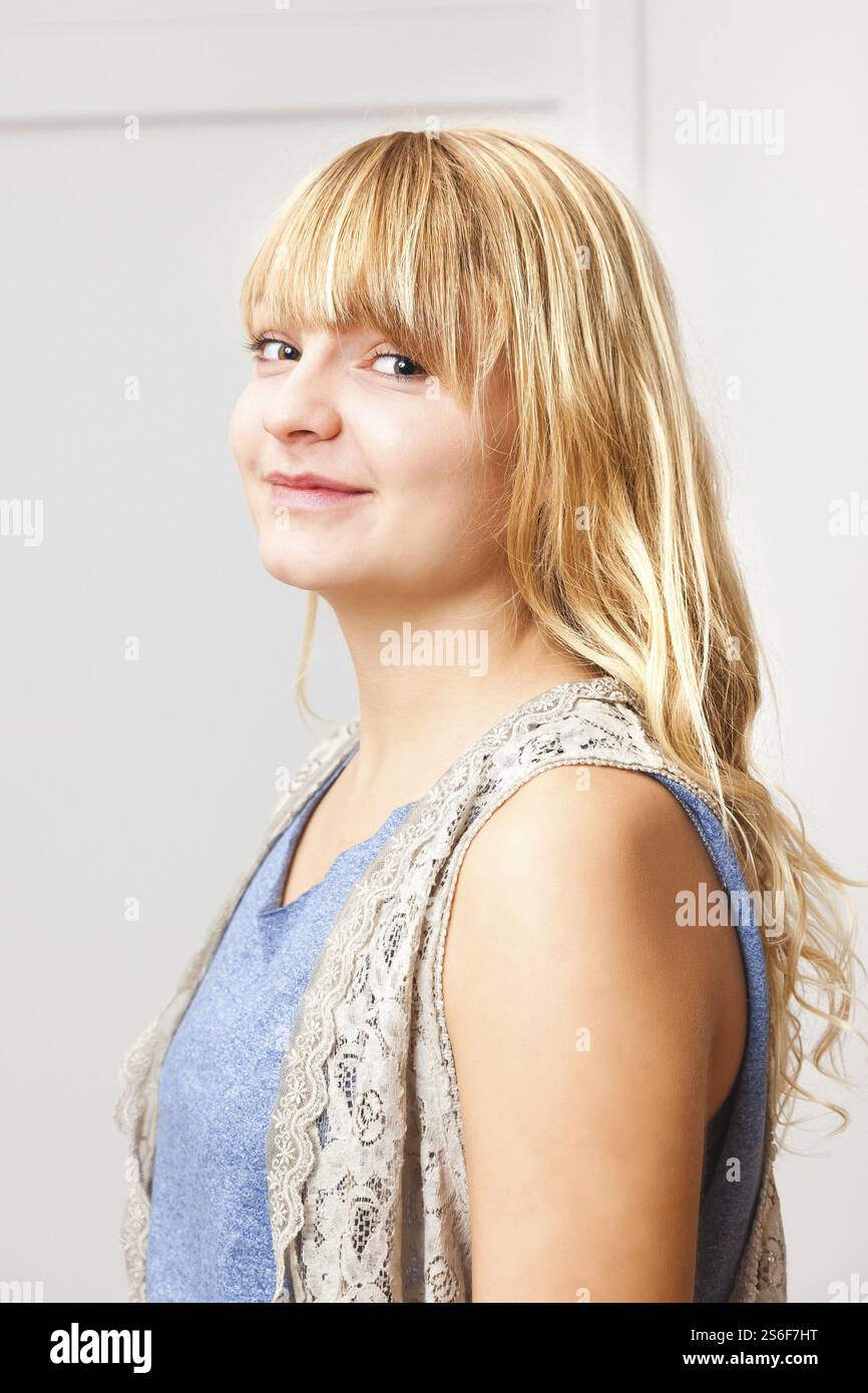 An image of a beautiful smiling blond girl Stock Photo - Alamy
