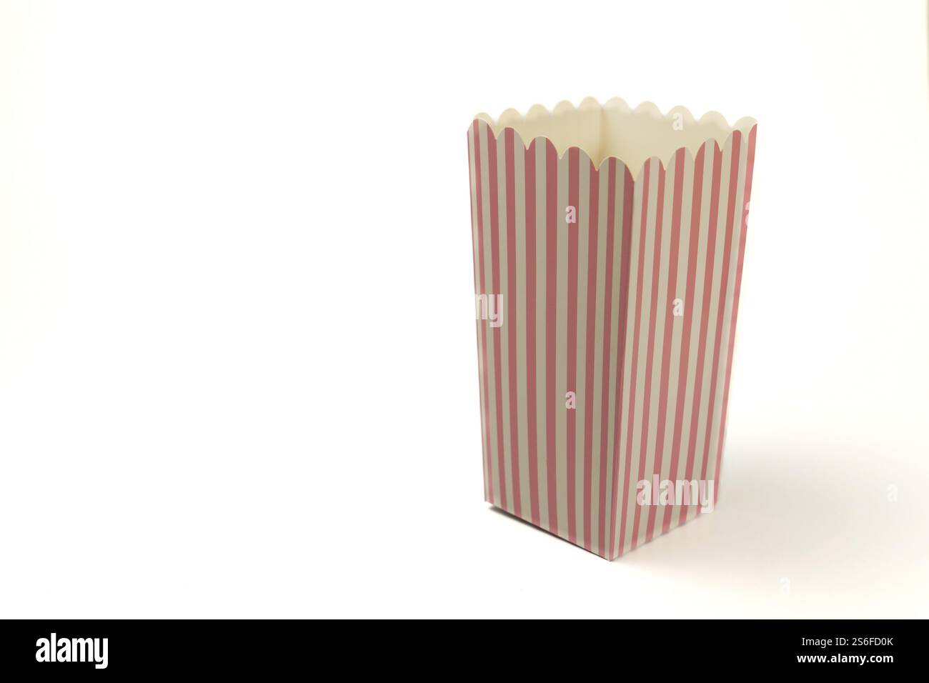 Empty popcorn package insulated on white background and copy space Stock Photo