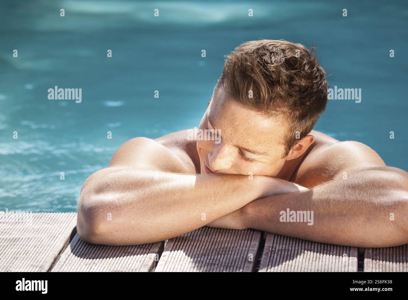An image of a handsome man in the pool Stock Photo - Alamy