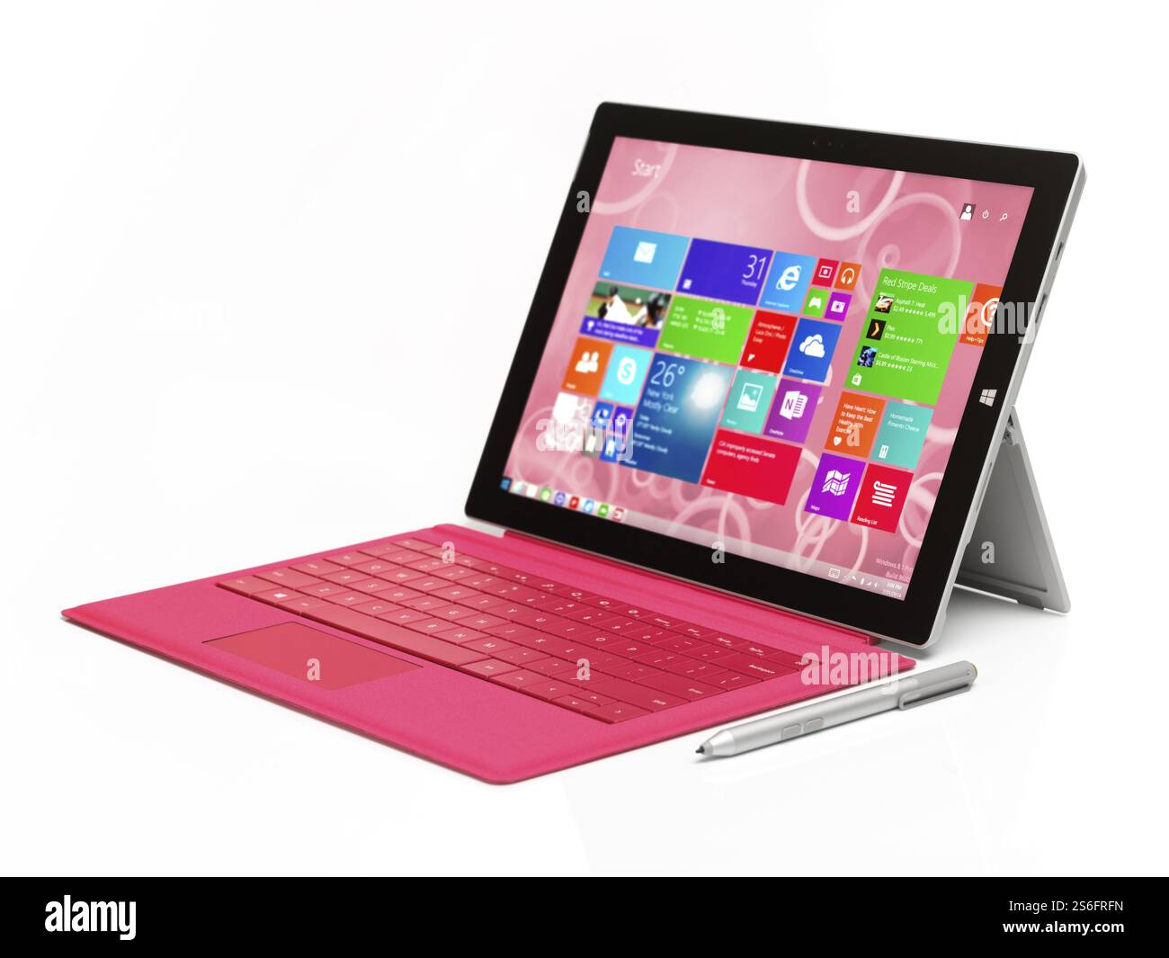 Microsoft Surface Pro 3 tablet computer with pink keyboard isolated on white background Stock Photo