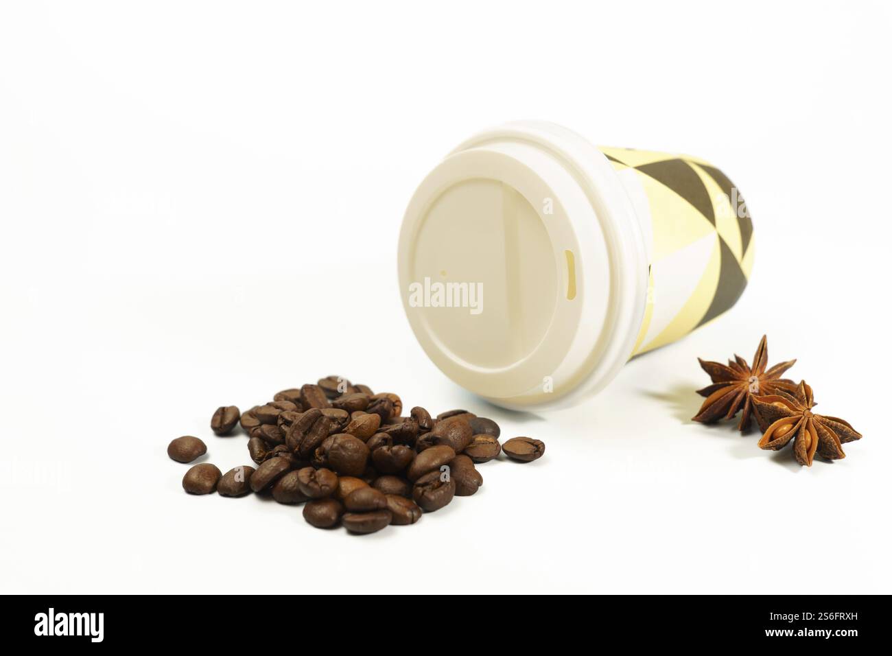 Cardboard coffee cup with coffee beans and star anise isolated on white background and copy space Stock Photo