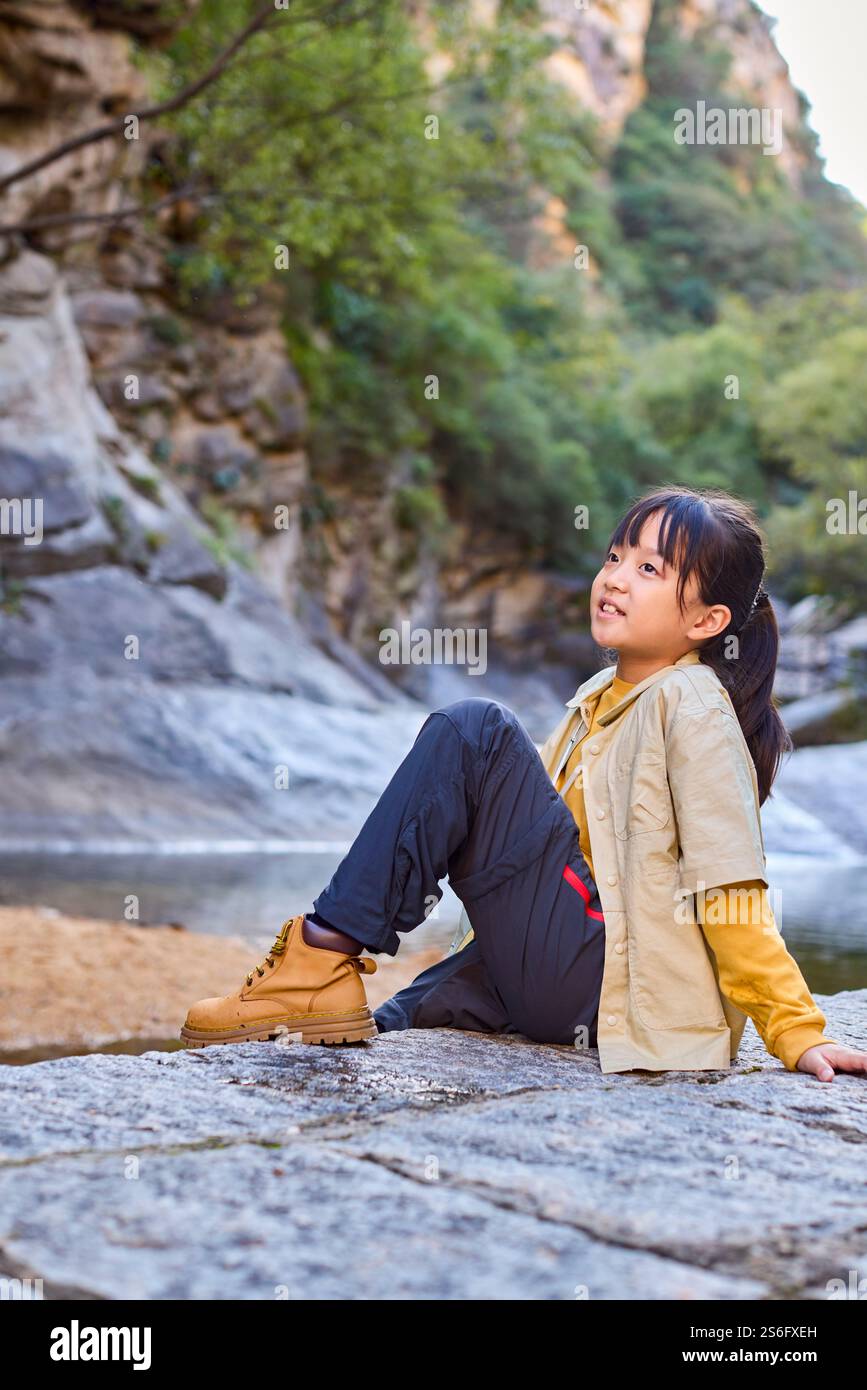 Side view indian girl sitting hi-res stock photography and images - Alamy