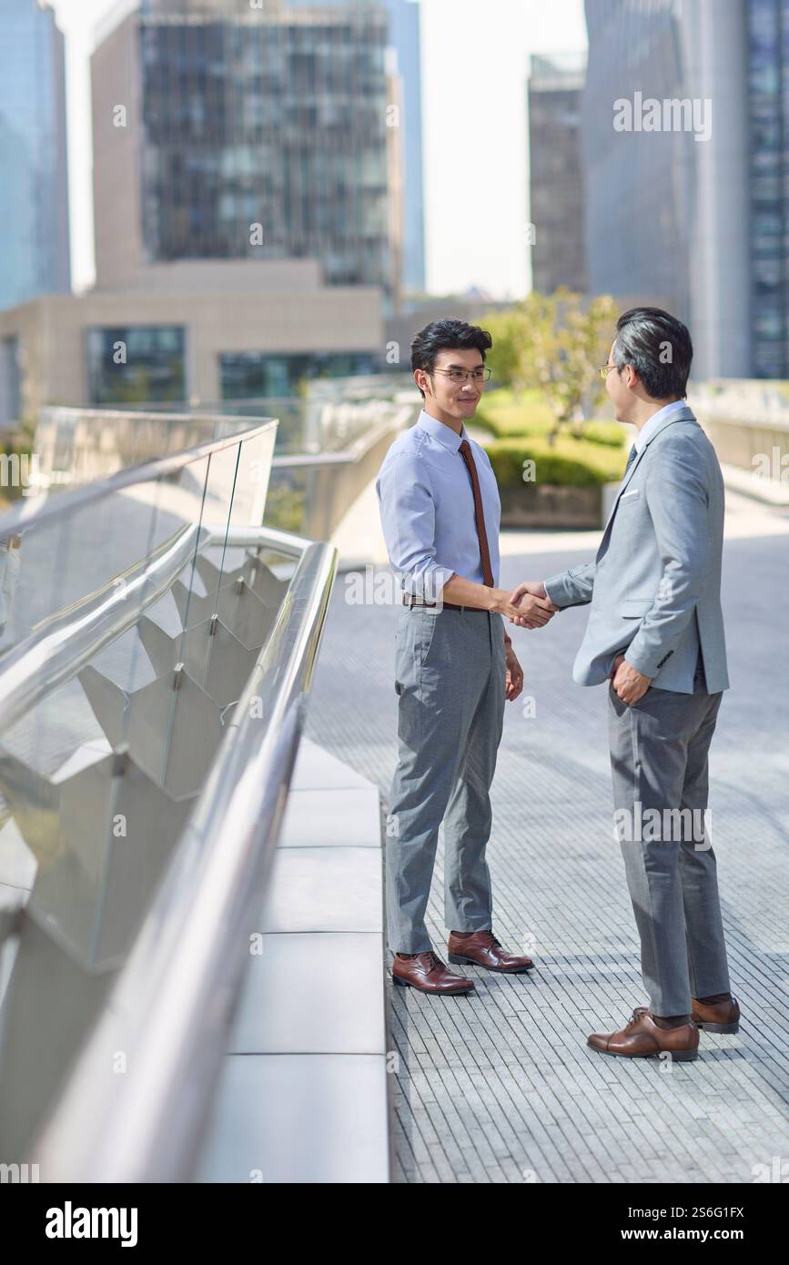 Business associates shaking hands Stock Photo