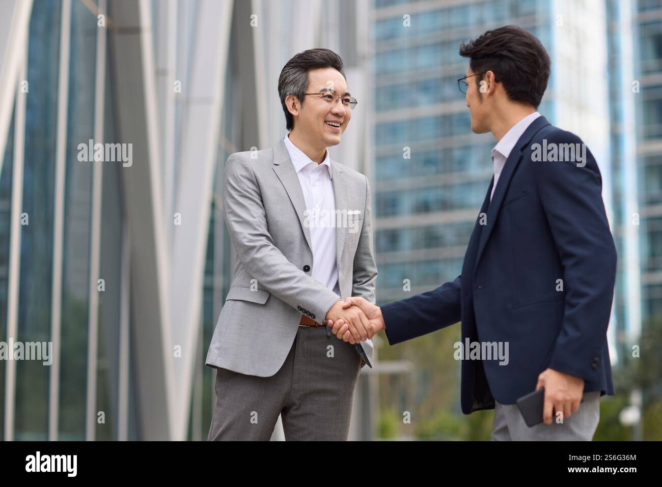 Business associates shaking hands Stock Photo