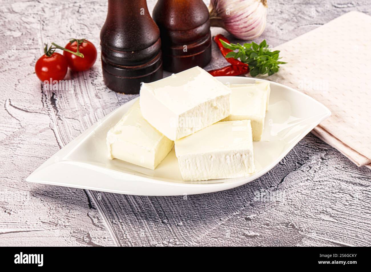 Greek traditional cuisine - Feta cheese bricks Stock Photo - Alamy