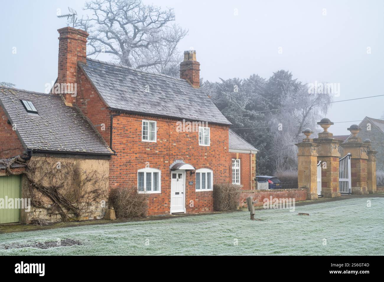 House in the winter mist and frost. Honington, Warwickshire, England Stock Photo