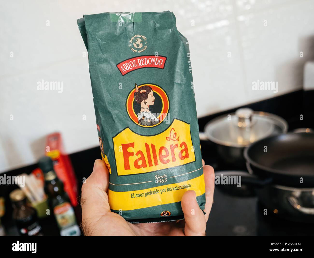 Mallorca, Spain - Jul 7, 2024: A hand holding a green La Fallera Arroz ...