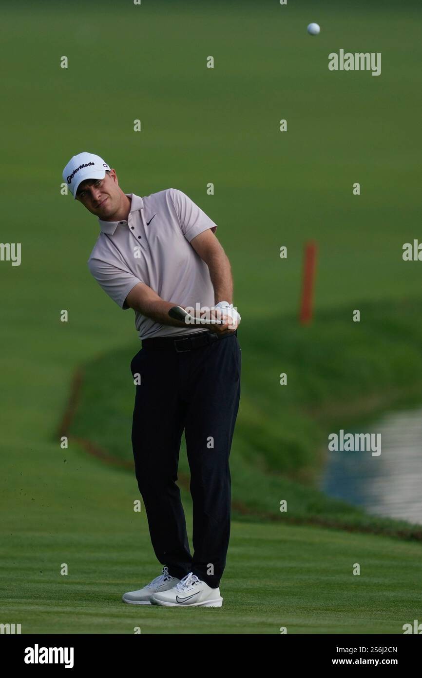 David Micheluzzi of Australia plays his second shot on the 9th hole