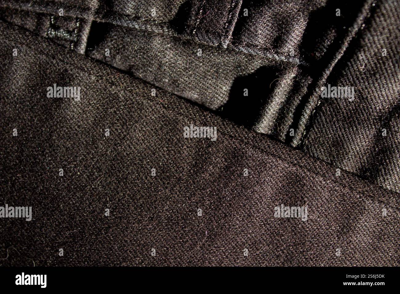 Black denim jean texture as background Stock Photo