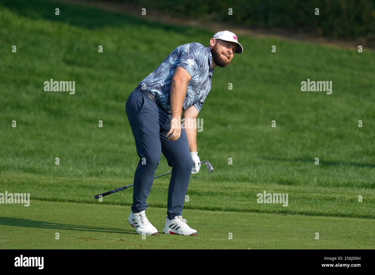 Tyrell Hatton of England reacts after playing his second shot on the