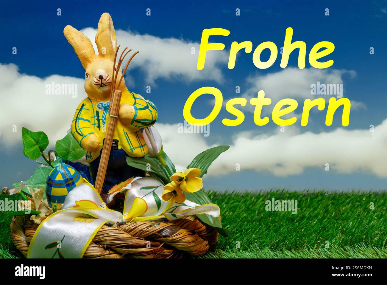 Easter greetings: Easter bunny with colourful Easter eggs with text FROHE OSTERN (Composing) Stock Photo