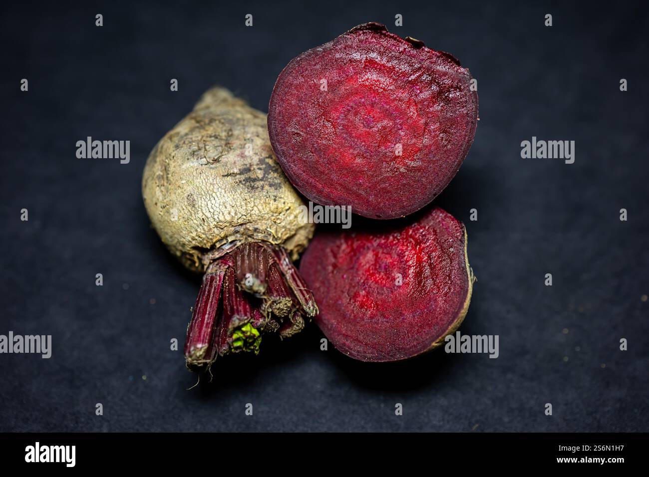 fresh raw beetroot slice close-up studio shot on black background Stock Photo