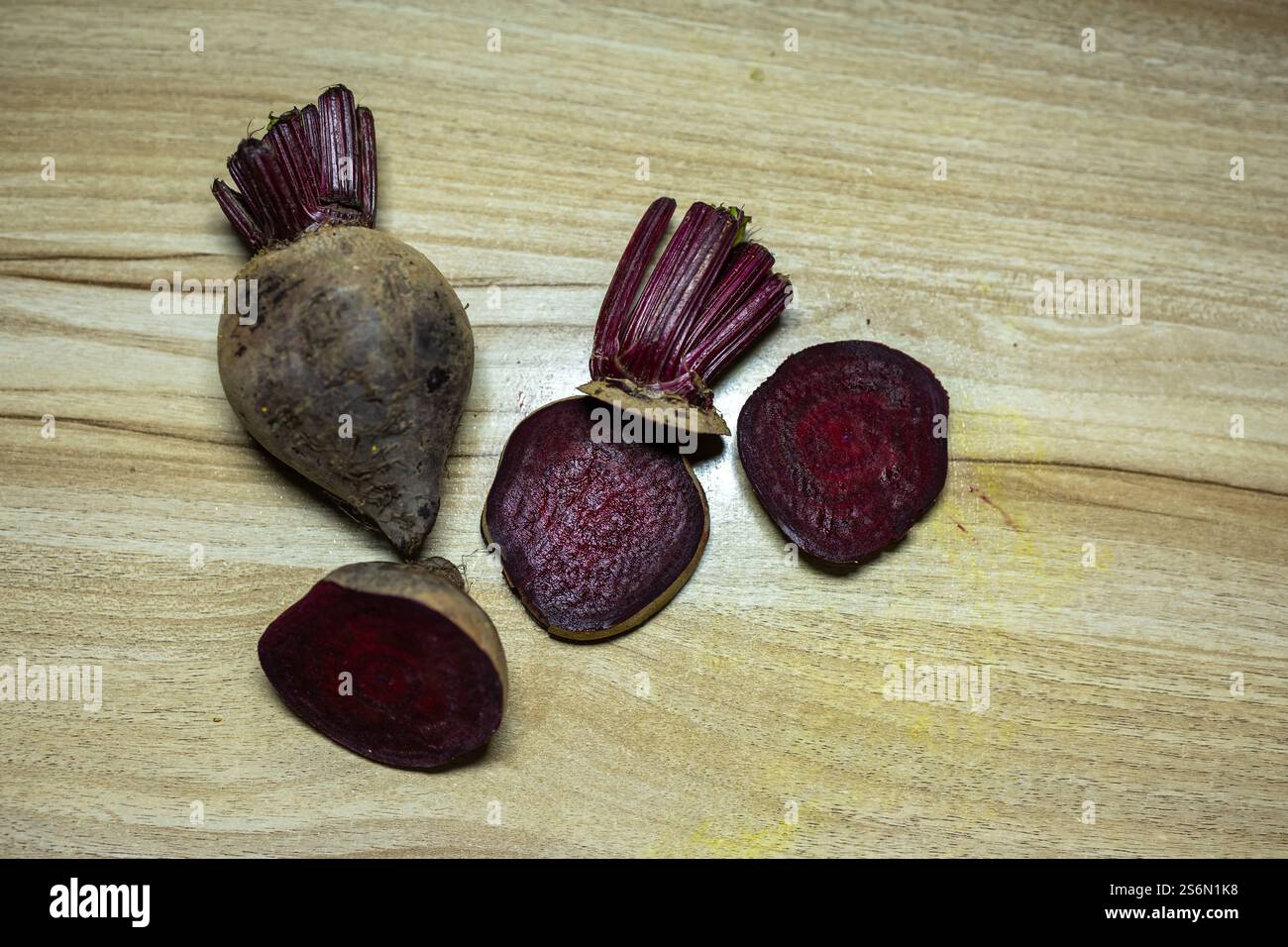 fresh raw beetroot slice close-up studio shot on wood background Stock Photo
