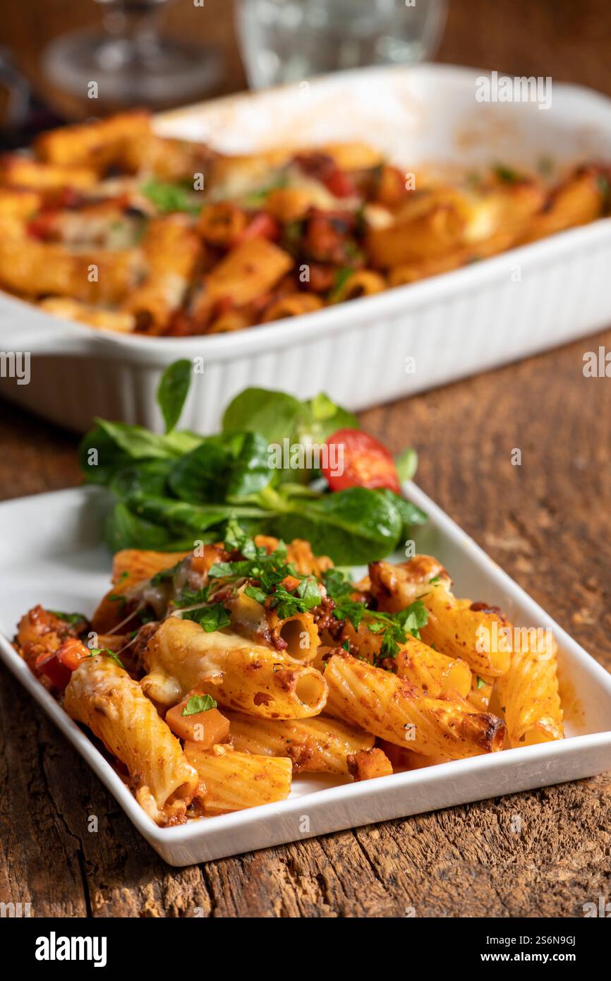 Rigatoni noodles au gratin with Bolognaise sauce Stock Photo