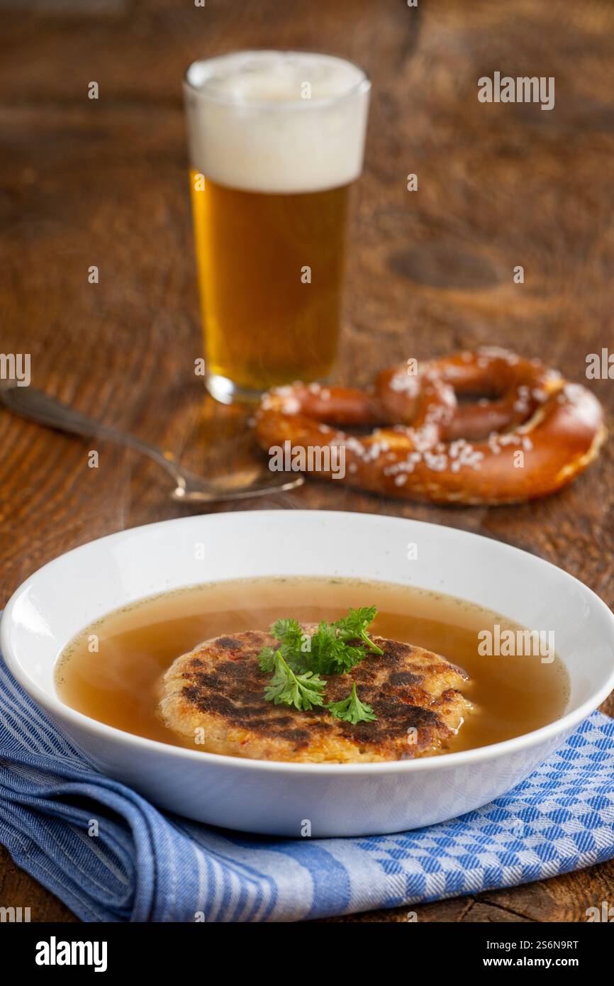 Austrian cheese dumpling soup on wood Stock Photo