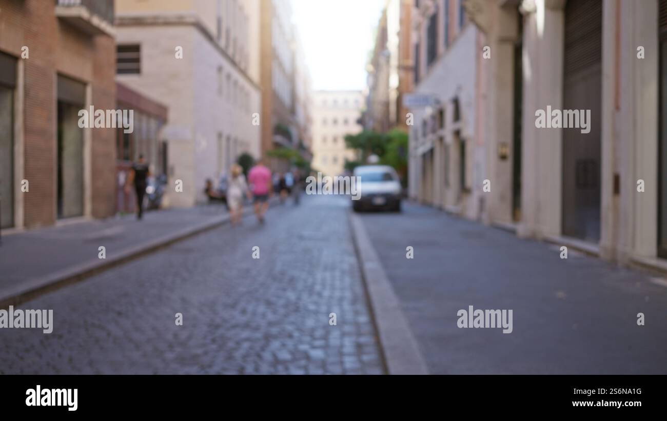 Blurred street scene in rome with people walking down a cobblestone ...