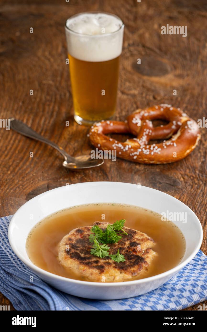 Austrian cheese dumpling soup on wood Stock Photo