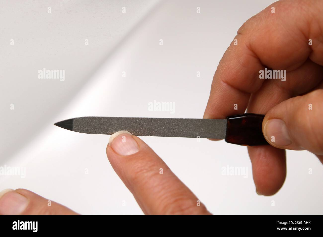 Finishing touches for fingernails Stock Photo
