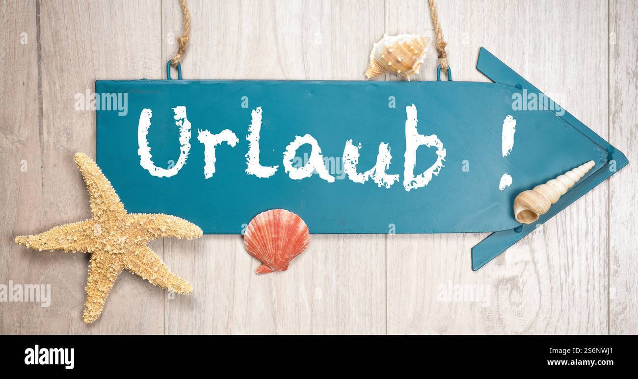 Blue metal sign with the inscription Urlaub! Stock Photo
