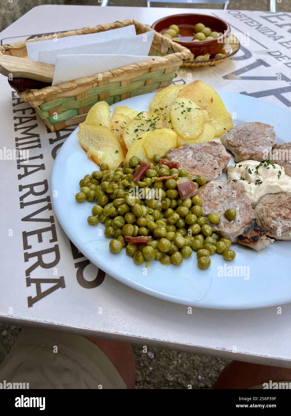 Pilgrim Meal, Potato, Peas, Cutlets, Bread, Olives, Eaten Outside a Bar: Simple Meal on the Camino Francés, Camino de Santiago - Smartphone Captured Stock Image