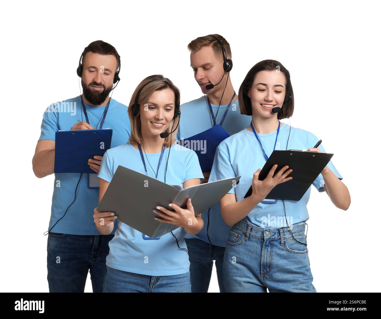 Technical support call center. Team of friendly operators working on ...