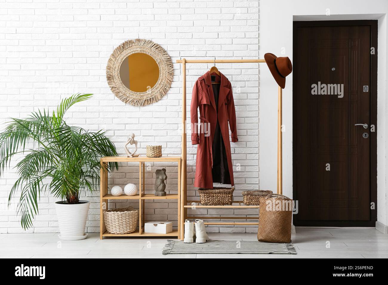 Stylish interior of modern hall and rack with coat Stock Photo - Alamy