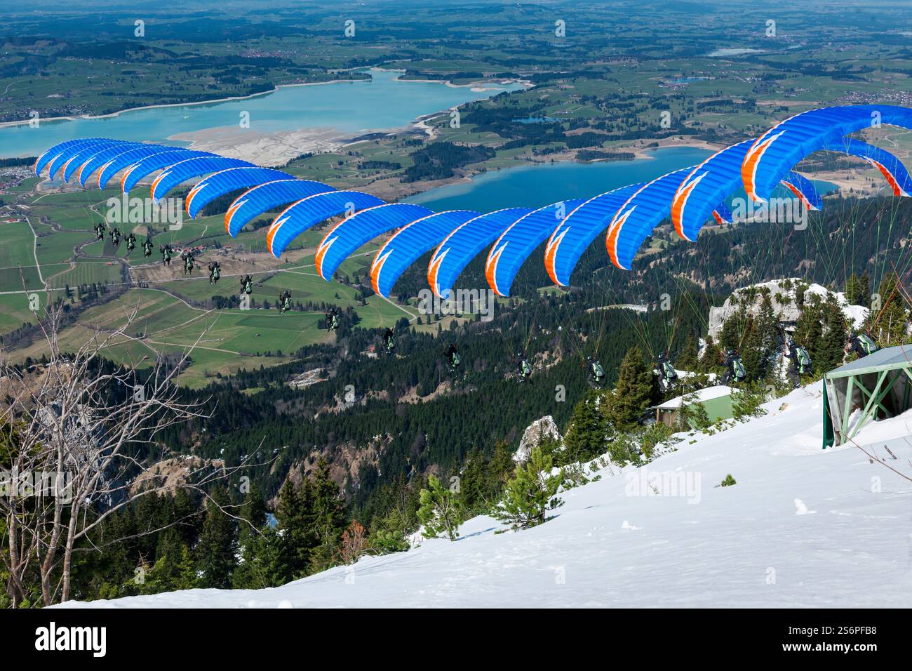 Sequence shot of a blue paraglider taking off from the launch ramp on ...