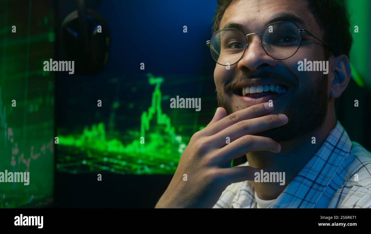 Thoughtful pensive Arabian Indian man thinking pondering solution programmer coder hacker worker cyberspace analysis male guy puzzled trader broker Stock Photo