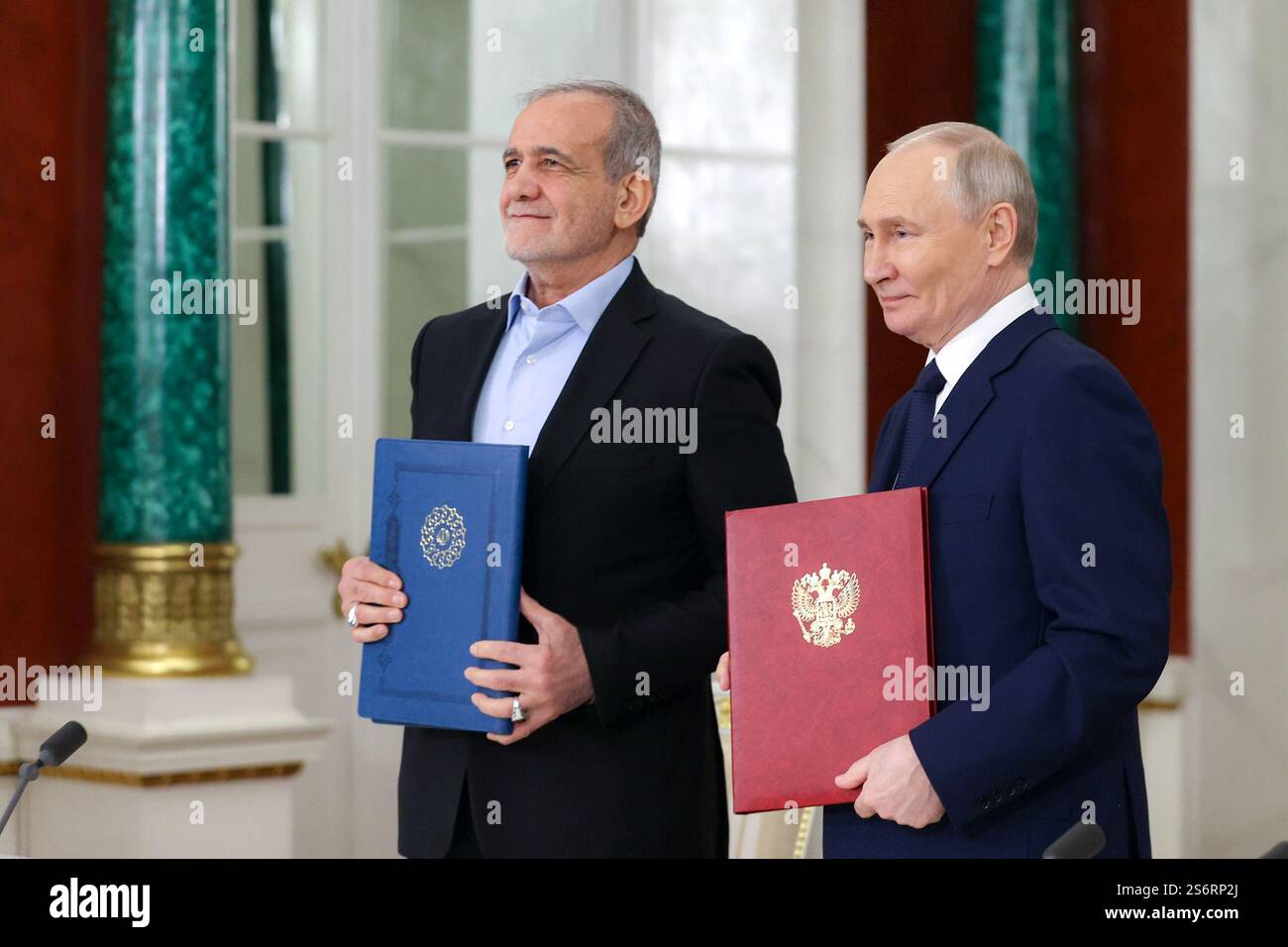 Moscow, Russia. 18th Jan, 2025. Russian President VLADIMIR PUTIN (R) and Iranian President MASOUD PEZESHKIAN (L) attend a signing ceremony for a partnership treaty to deepen their ties after their talks at the Kremlin in Moscow. The Iranian president is visiting Moscow to meet with President Putin, where they will discuss and sign a comprehensive strategic partnership agreement. (Credit Image: © Iranian Presidency via ZUMA Press Wire) EDITORIAL USAGE ONLY! Not for Commercial USAGE! Stock Photo